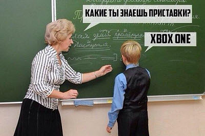 Школьник и учительница у доски на уроке русского языка